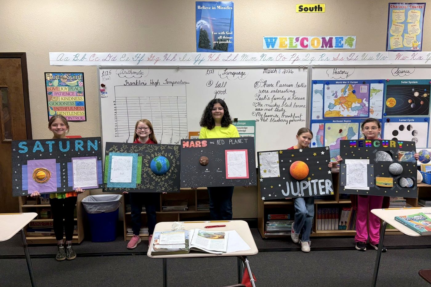 Students presenting solar system projects